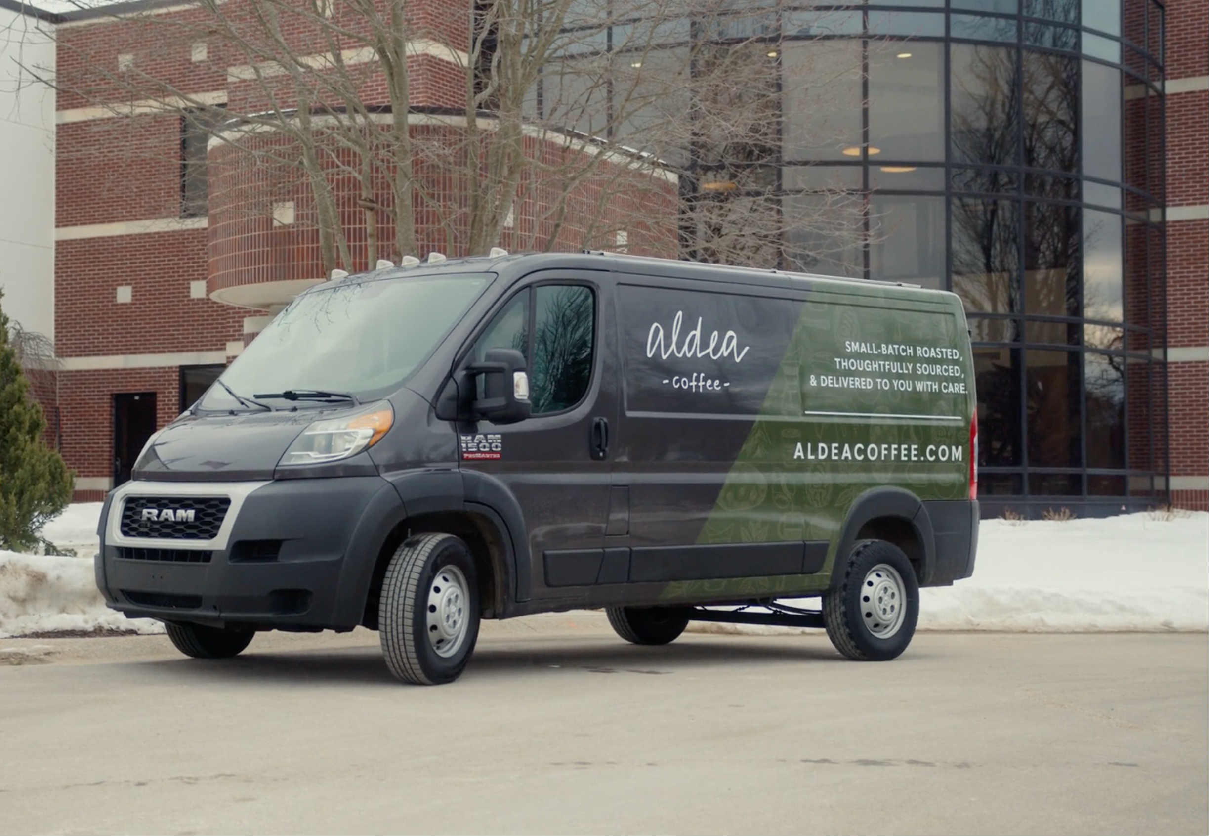 Delivery vehicle with Aldea Coffee branding
